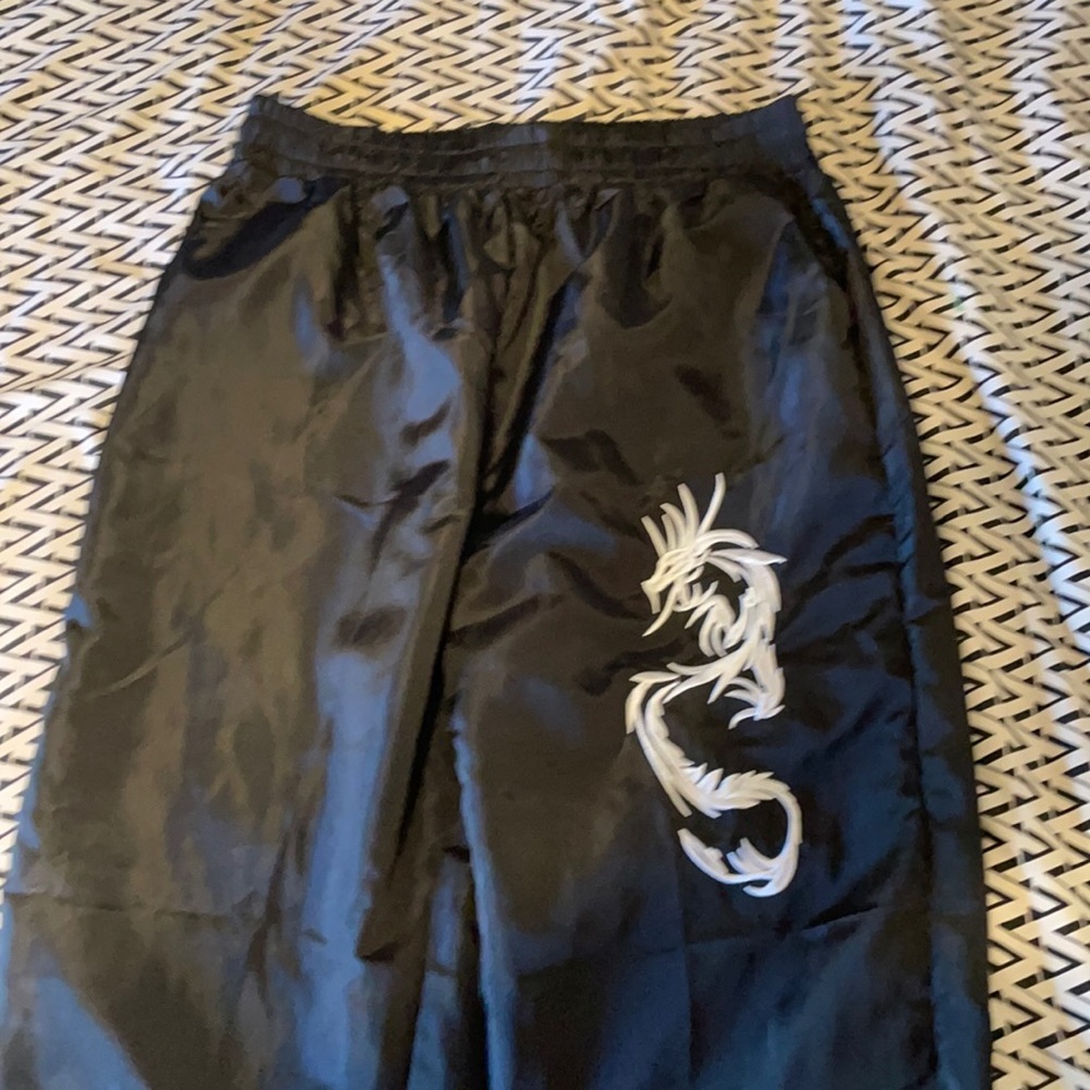 Black pants with white dragon